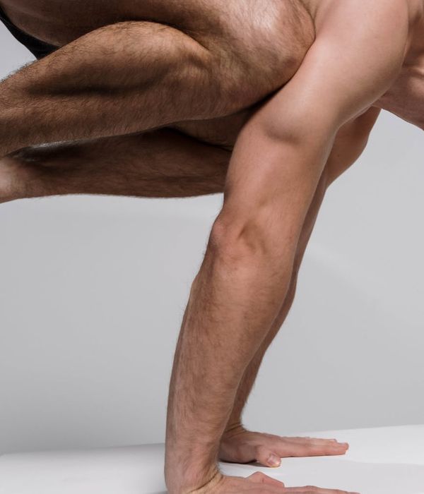 Man performing a core strength exercise in a calm, focused environment.