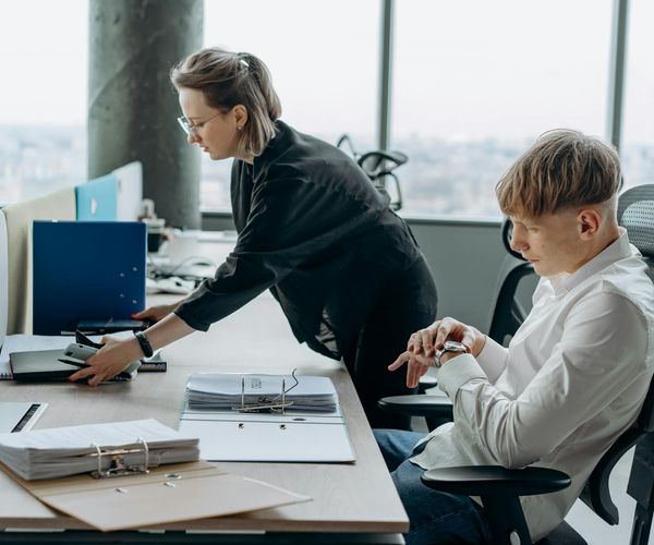 Man working at a standing desk with correct posture.